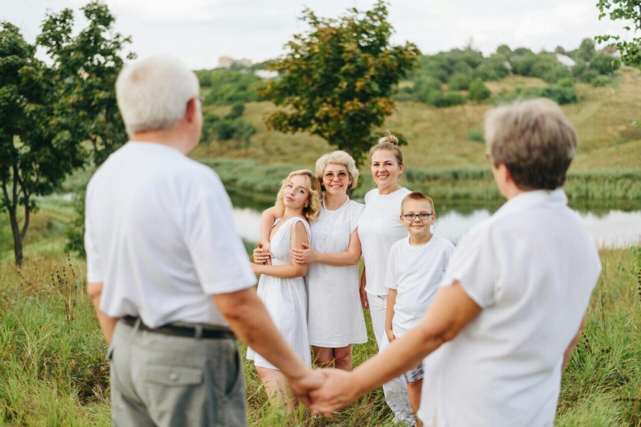 a group of people standing in a field